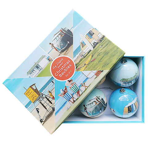 Six acrylic Christmas baubles featuring NZ Kiwi Summer scenes — bach, beach, tractor and more — by Graham Young Artist